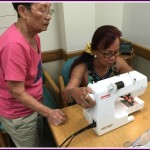Photo of Mrs. Lum and Mary sewing