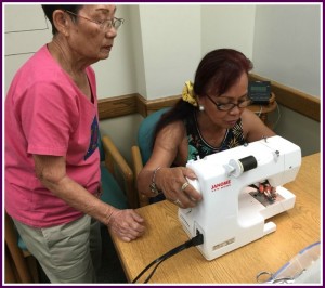 Photo of Mrs. Lum and Mary sewing