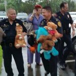 Photo of HPD unloading the stuffed animals from the cars