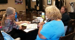 Picture of 2 ladies and Lani at Maui Peer Support Group meeting