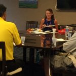 Photo of Kathleen speaking to VI and Blindness group around conference table