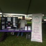 Photo of Lani standing behind display table