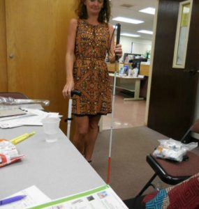 Photo of Kathleen doing white cane demo