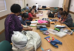 Photo of LivZen members working on sewing projects