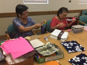 Photo of LivZen members working on sewing projects