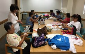 Photo of LivZen members working on sewing projects