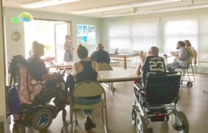 Photo of Hale Kuhao residents listening to presentation