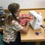 Photo of Mary sewing a happi coat