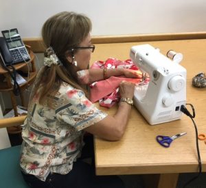 Photo of Mary sewing a happi coat