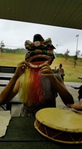 Youth wearing year of the dog mask