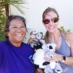 Photo of Lani and woman with stuffed animals