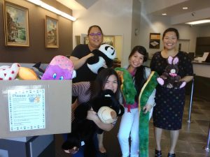 Photo of staff from Territorial Savings Bank with stuffed animals