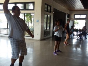 Photo of Brian, Lani, and Kathleen doing the Zumba