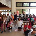 Photo of Zumba group holding stuffed animals