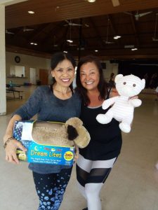 Photo of 2 participants with stuffed animals