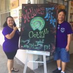 Photo of Roxanne and Tom at entrance sign