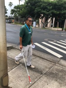 Photo of participant walking using white cane