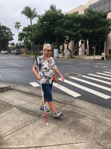 Photo of participant walking with white cane