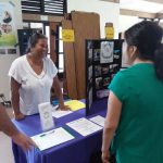 Photo of Lani speaking to lady at fair