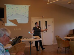 Photo of workshop leader speaking in front of group