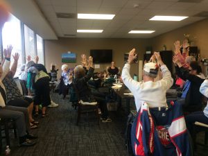 Photo of VIBES group doing chair yoga