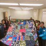 Photo of Liv Zen group holding elephant blanket