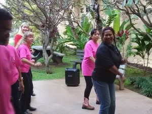 Photo of Lani line dancing with group