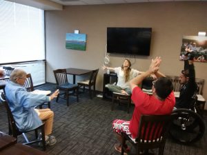 Photo of group practicing open arms pose