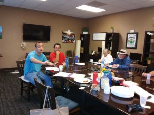 Photo of Ted Anderson speaking to group