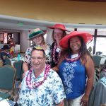 Photo of Judy Guajardo, Brian, Kathleen, and Lani wearing hats