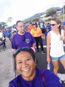 Photo of Lani selfie with Brian and Kathleen in background